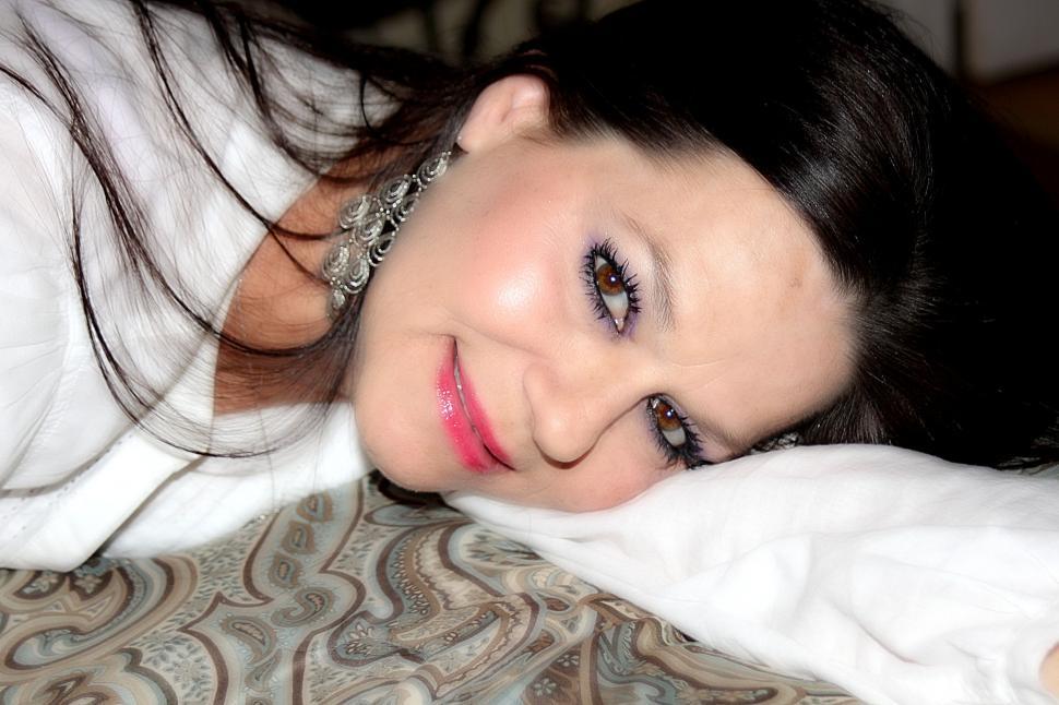 Free Image of Woman Lying Down on Bed - Eye Contact  