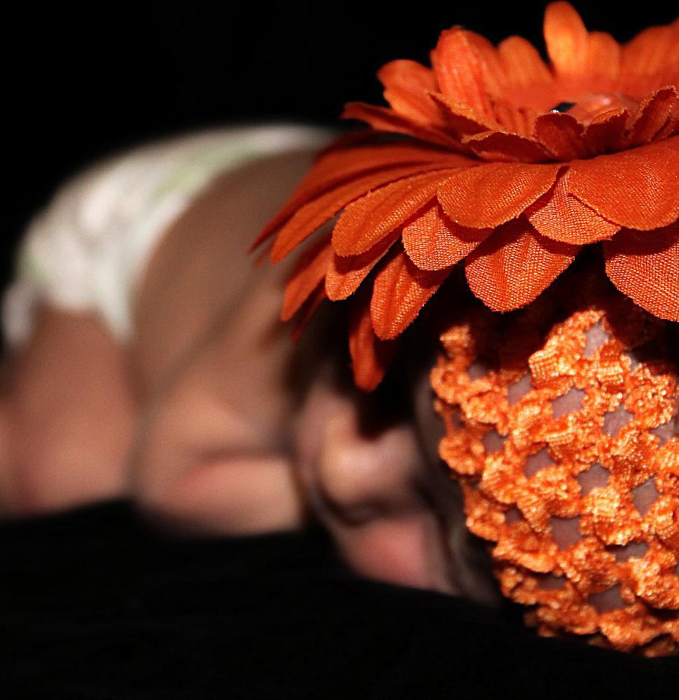 Free Image of Newborn Baby in Flower Hat  
