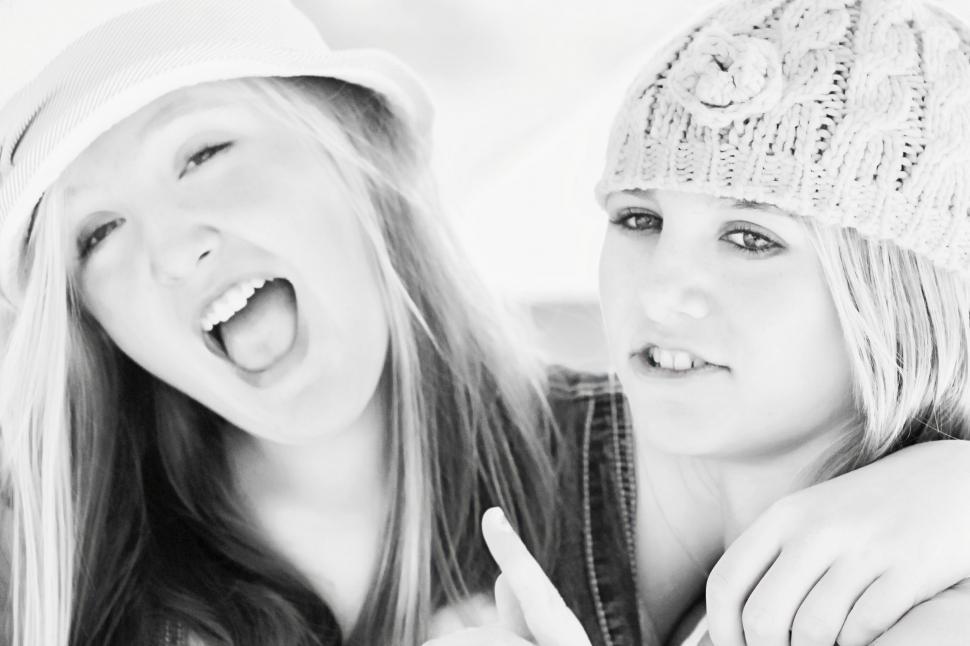 Free Image of Black and white view of Girlfriends in Hats 