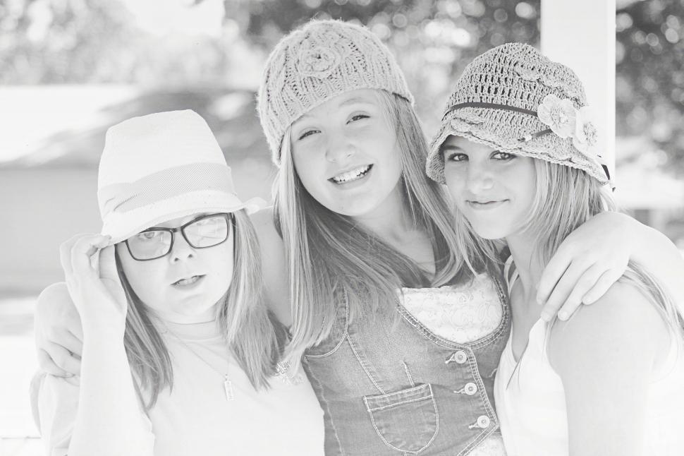 Free Image of Black and white view of three Girlfriends in Hats 