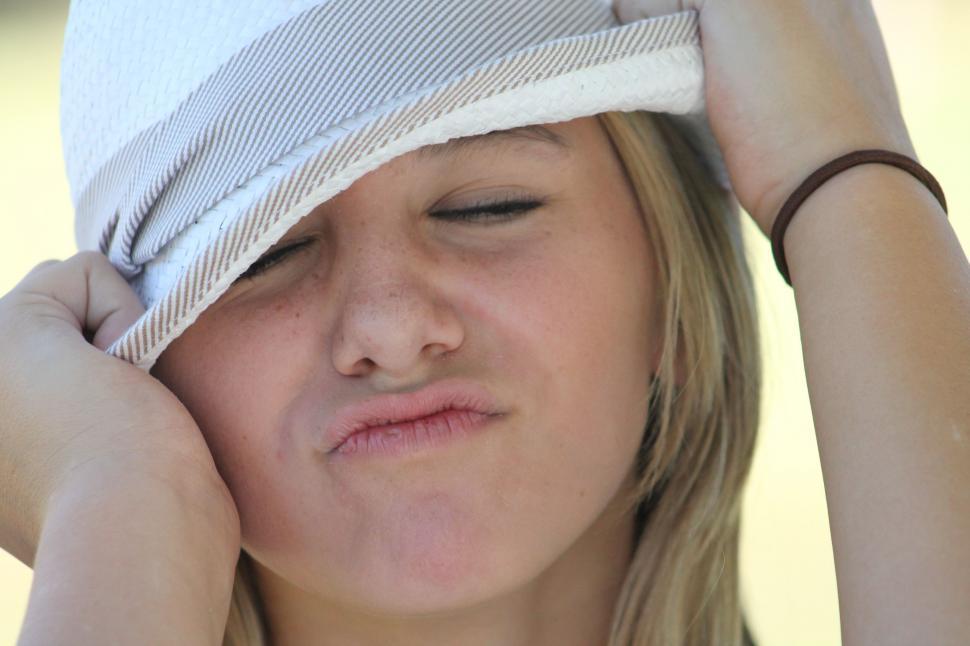 Free Image of Young Girl in Hat - Making Face  