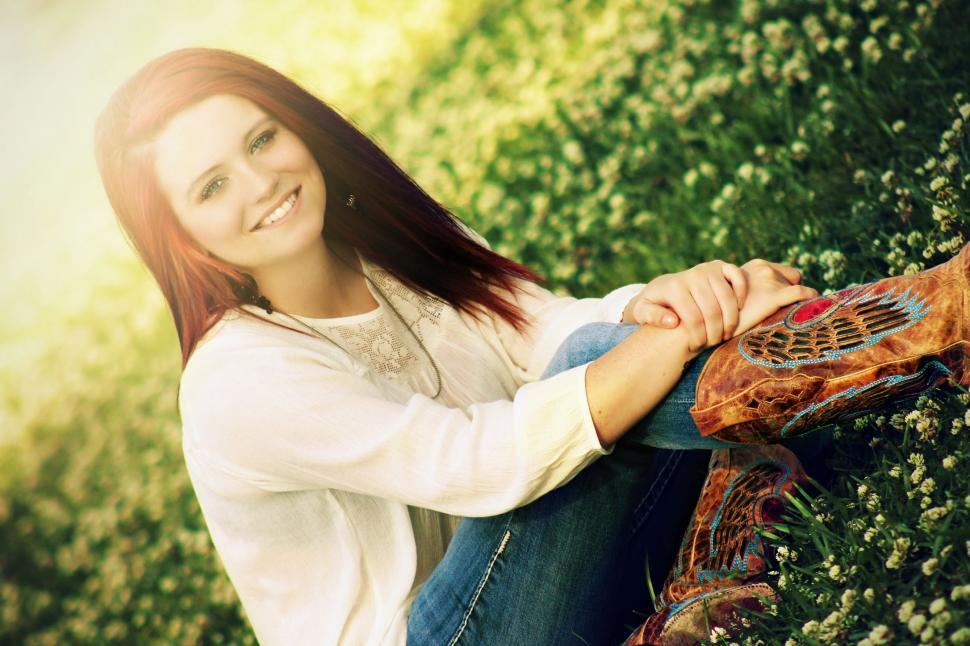 Free Image of Red Hair Woman posing in the park 