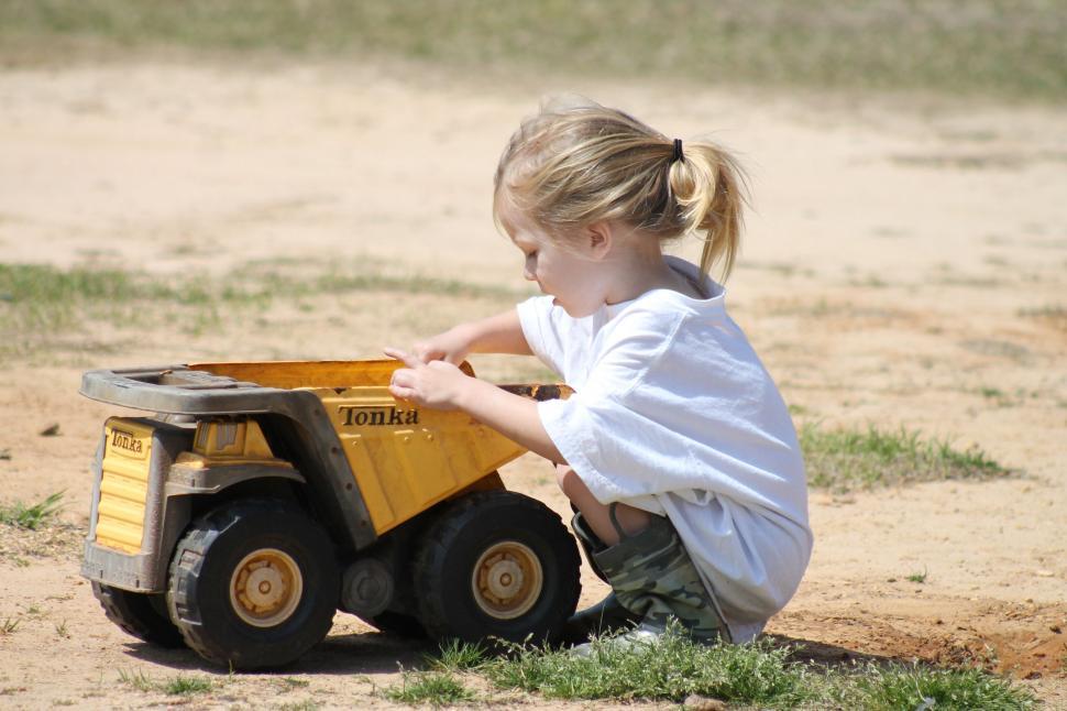 Free Image of Little Girl with Tonka truck 