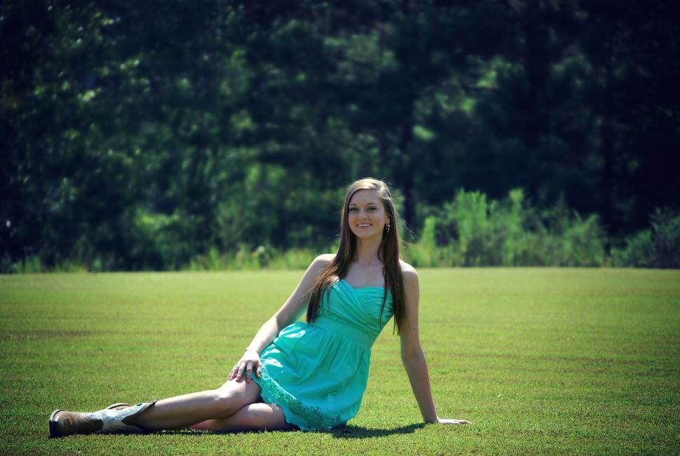 Free Image of Woman Posing on Green Grass - Looking at camera  