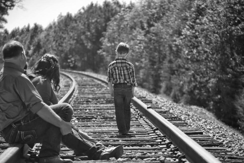 Free Image of Family on rail track road  