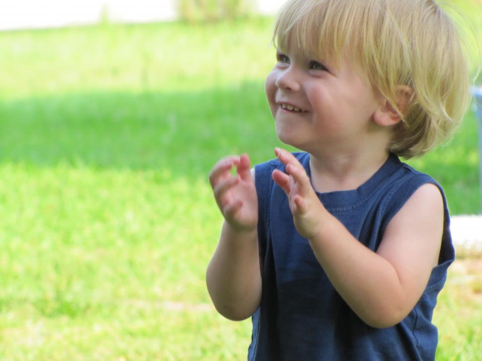 Free Image of Smiling Little Boy and green grass  