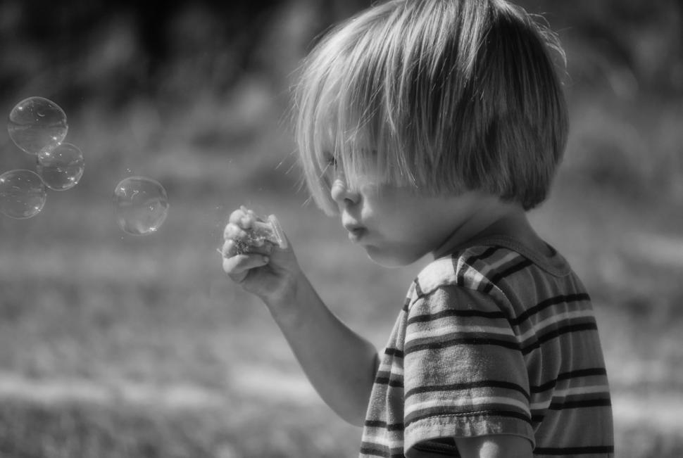 Free Image of Little Boy Playing With Bubbles  