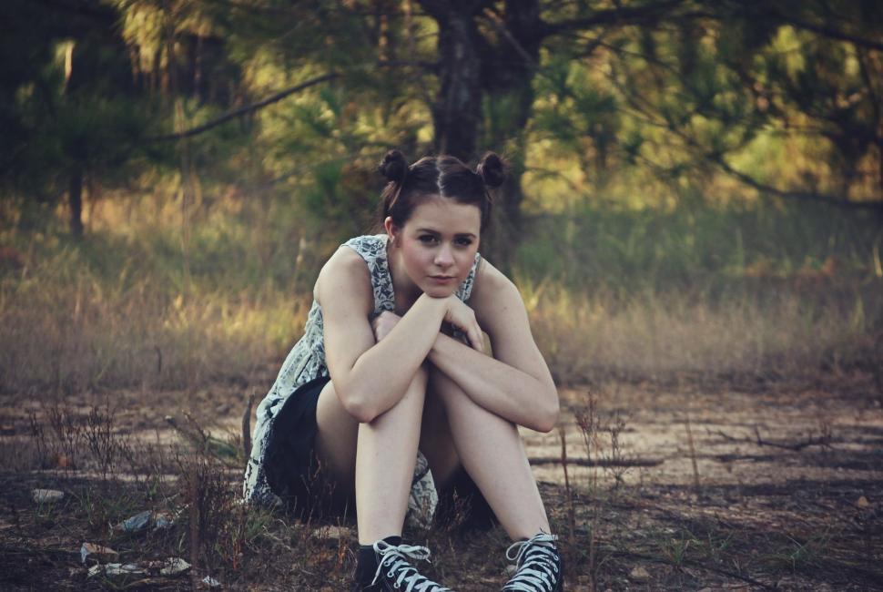 Free Image of Teenage Girl Sitting in the forest 