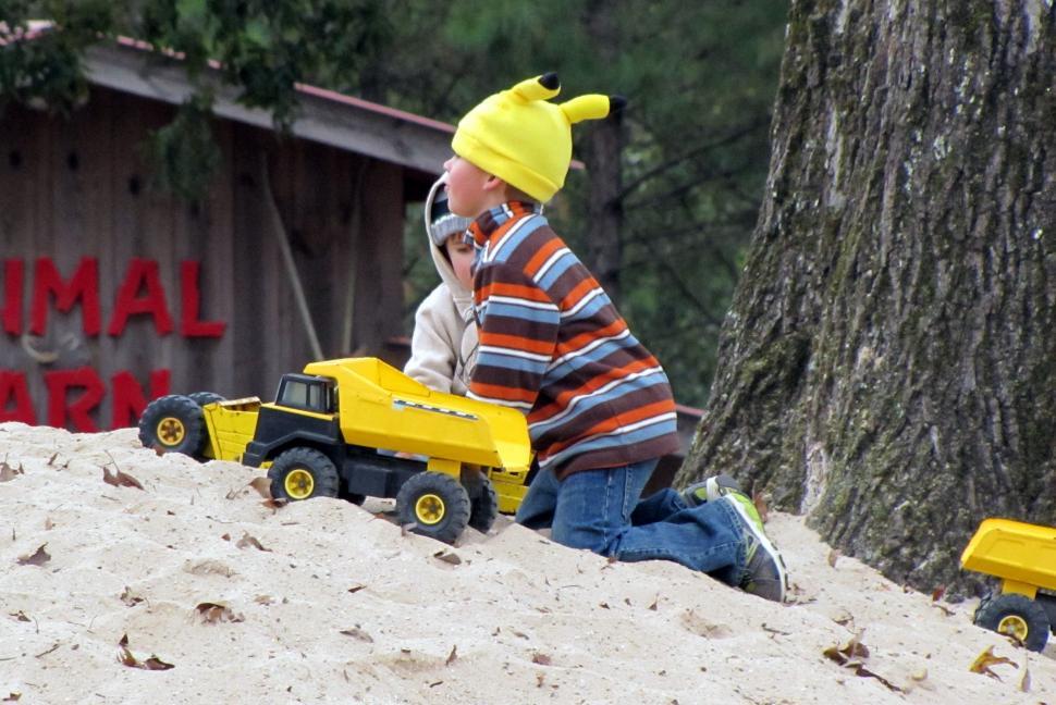 Free Image of Kids Playing With Toy Cars  