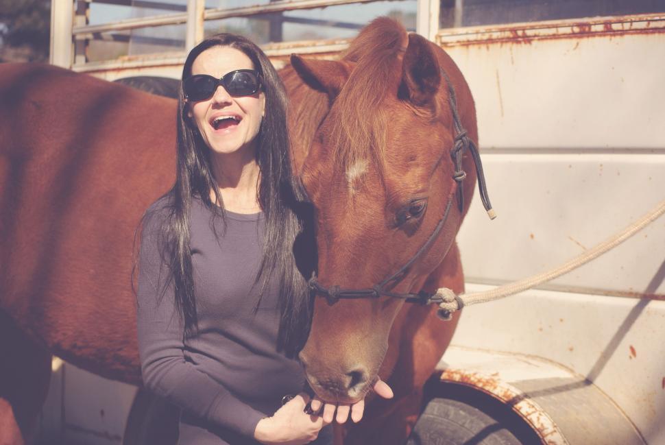 Free Image of Smiling Woman With Horse  