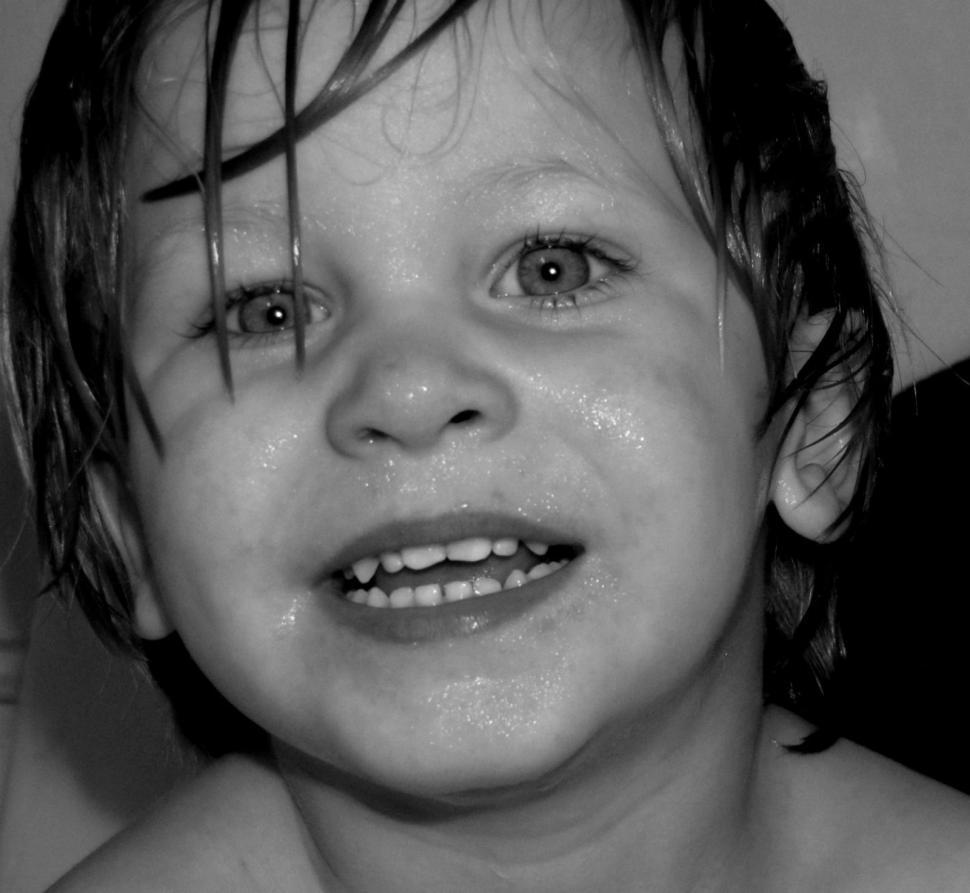 Free Image of Smiling Little Boy With Wet Face - B&W 