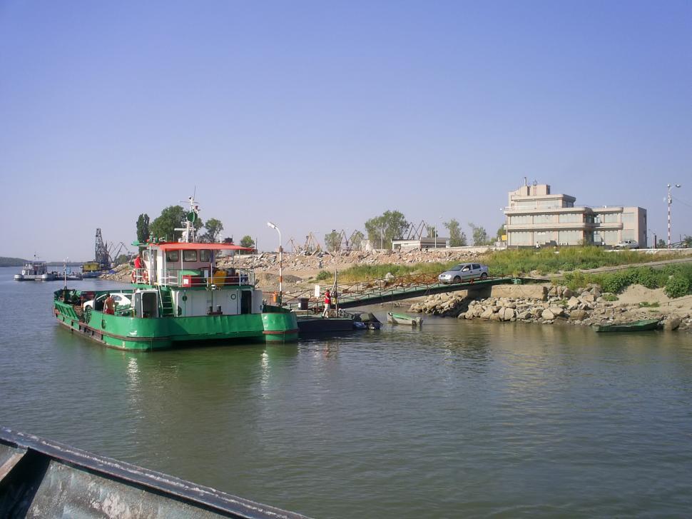 Free Image of Small barge with car on the bridge 