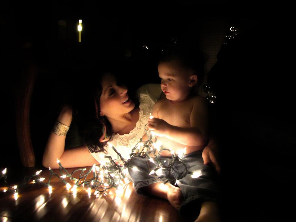 Free Image of Mother and Child With Christmas Lights 