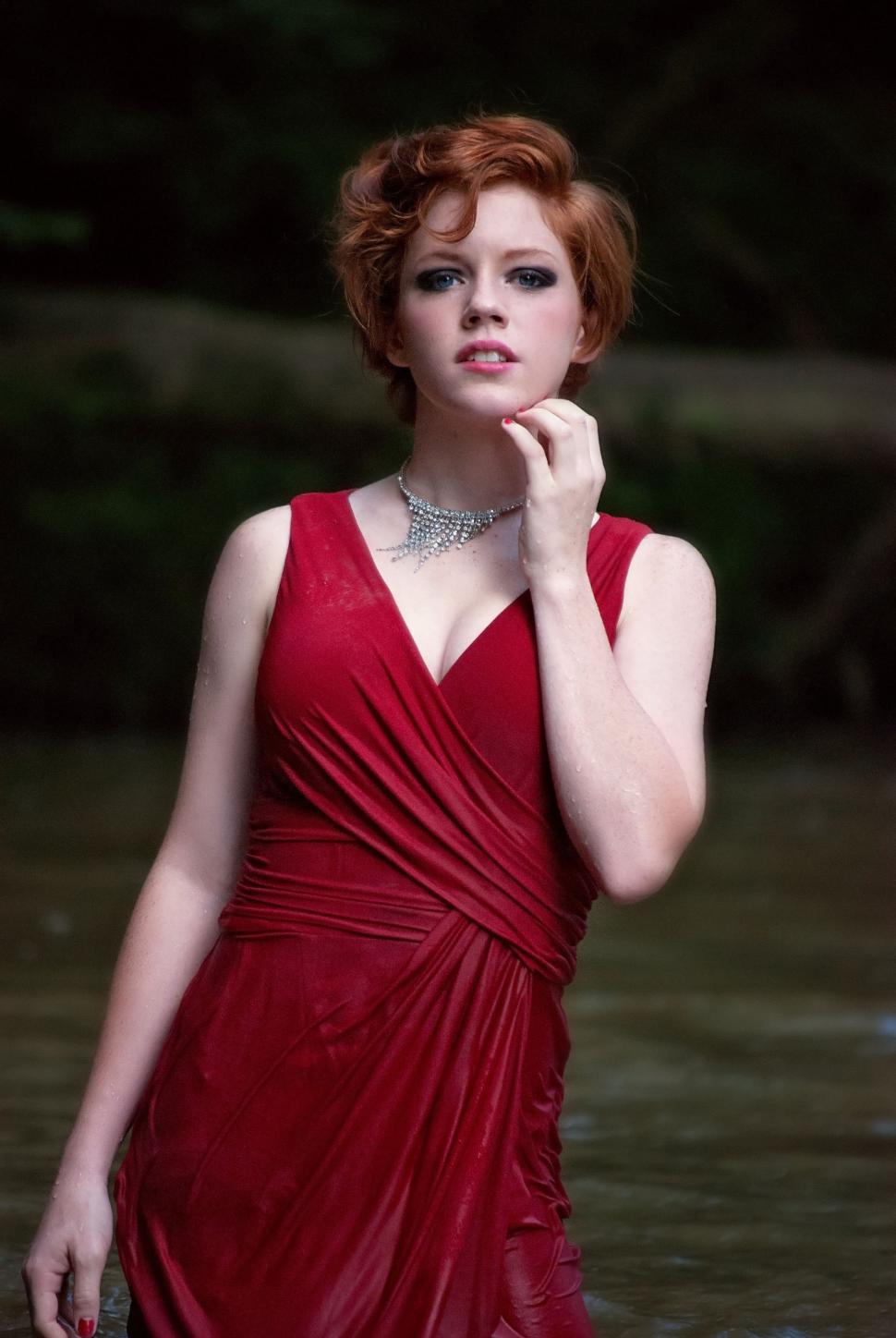 Free Image of Young Female Fashion Model in Wet Red Dress - Looking at camera  