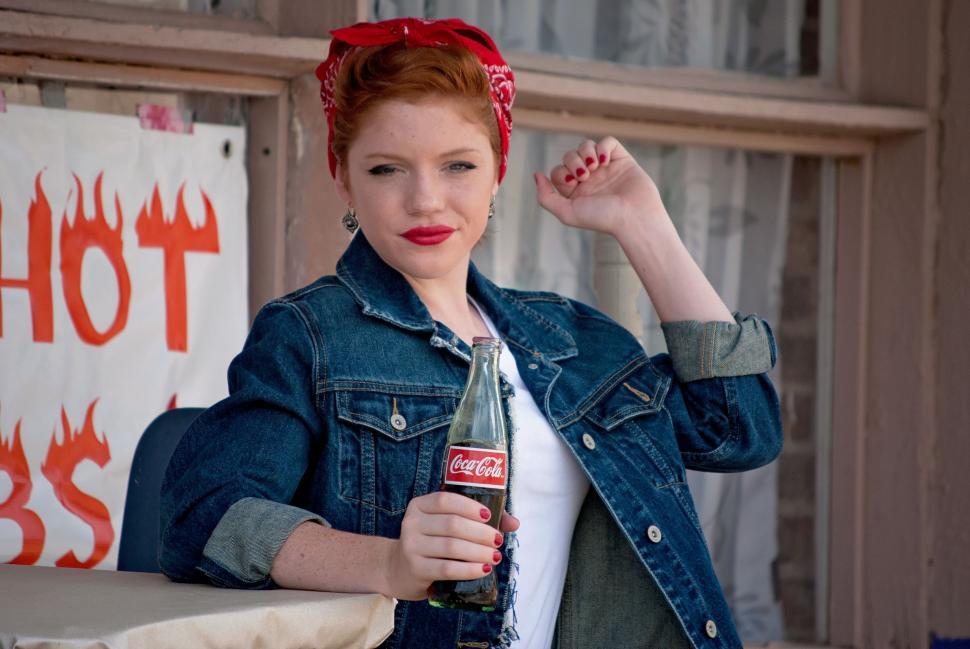 Free Image of Redhead Woman in Vintage Clothing With Coke Bottle - Looking at camera  