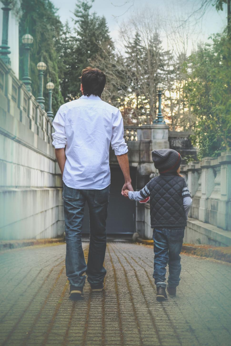 Free Image of Back view of Father and Son Walking Together  