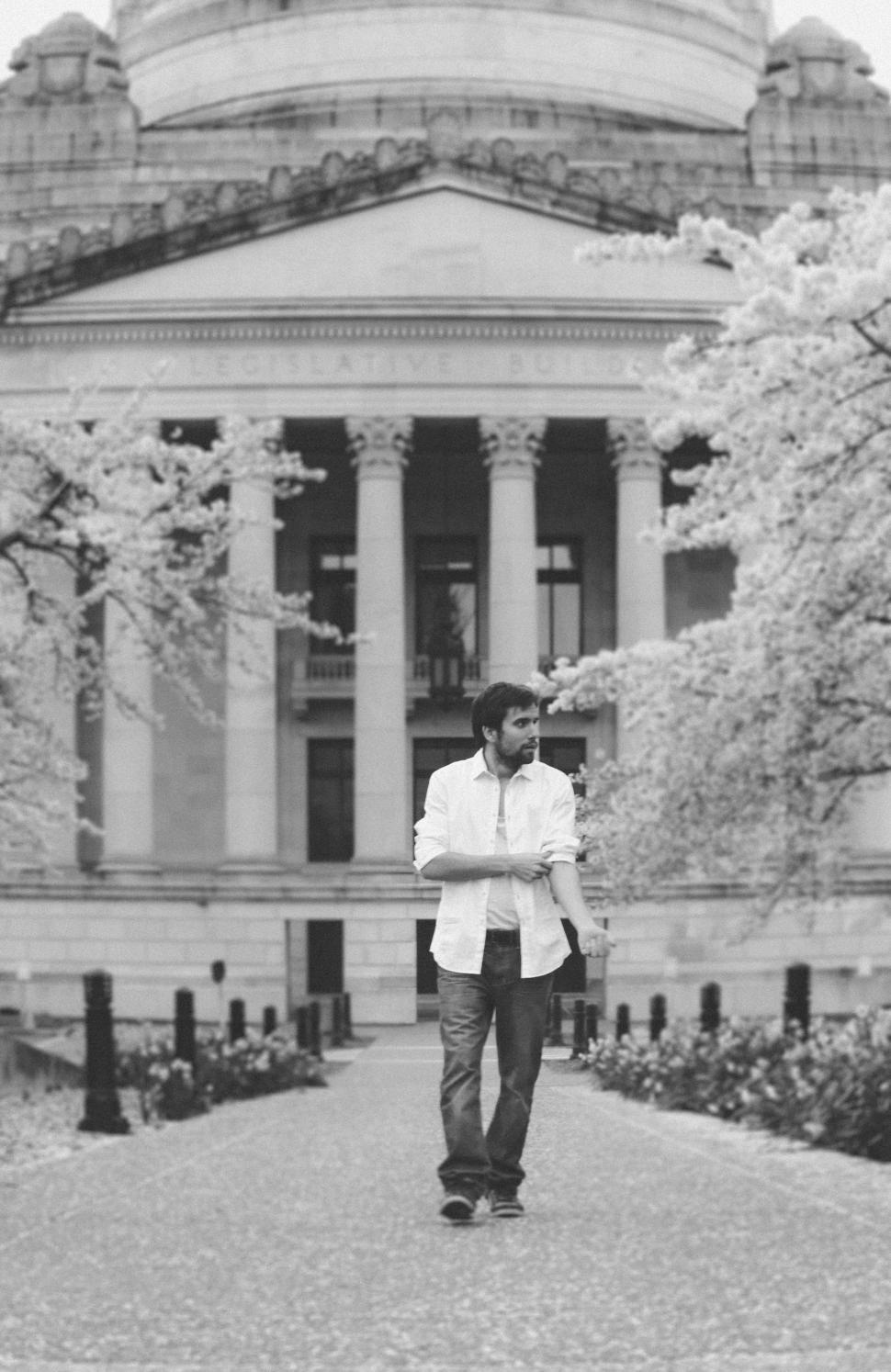 Free Image of Young Man and Washington State Capitol Building With Cherry Blossom - B&W 
