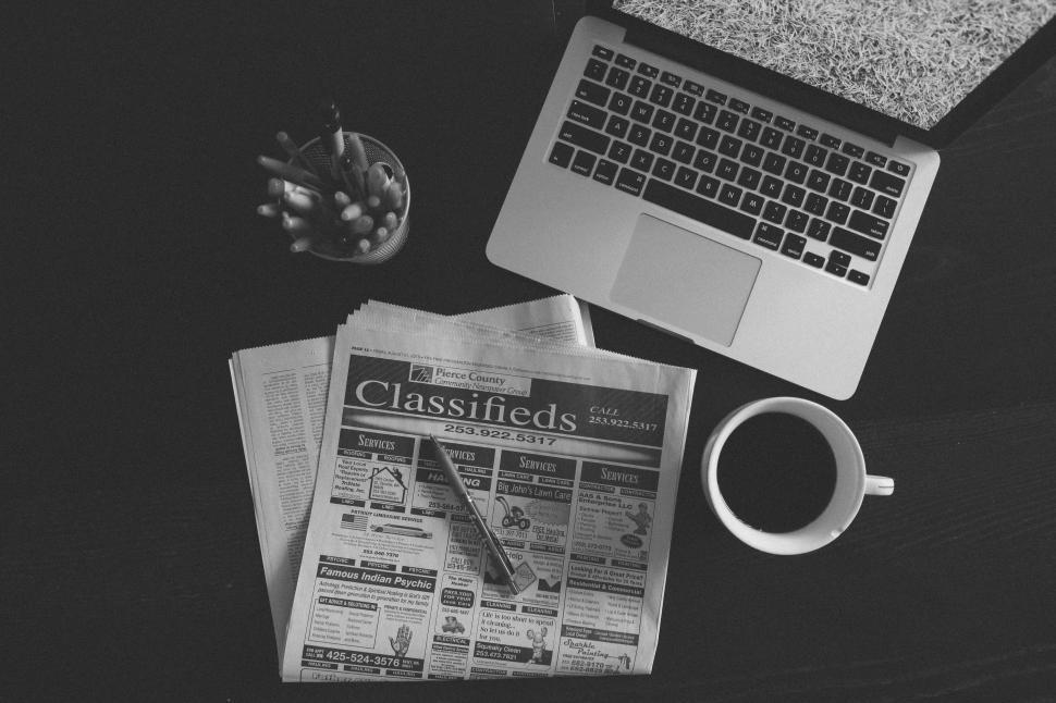 Free Image of Office Desk: Newspaper and Laptop  