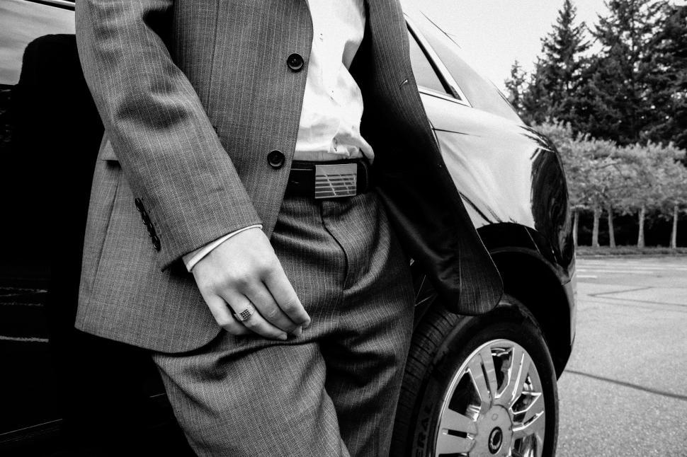 Free Image of Unrecognizable Man in Suit and Trousers at parking lot  
