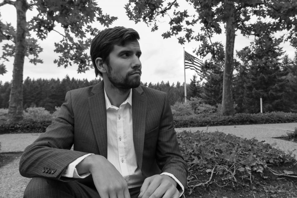 Free Image of Businessman sitting in the park - B&W 