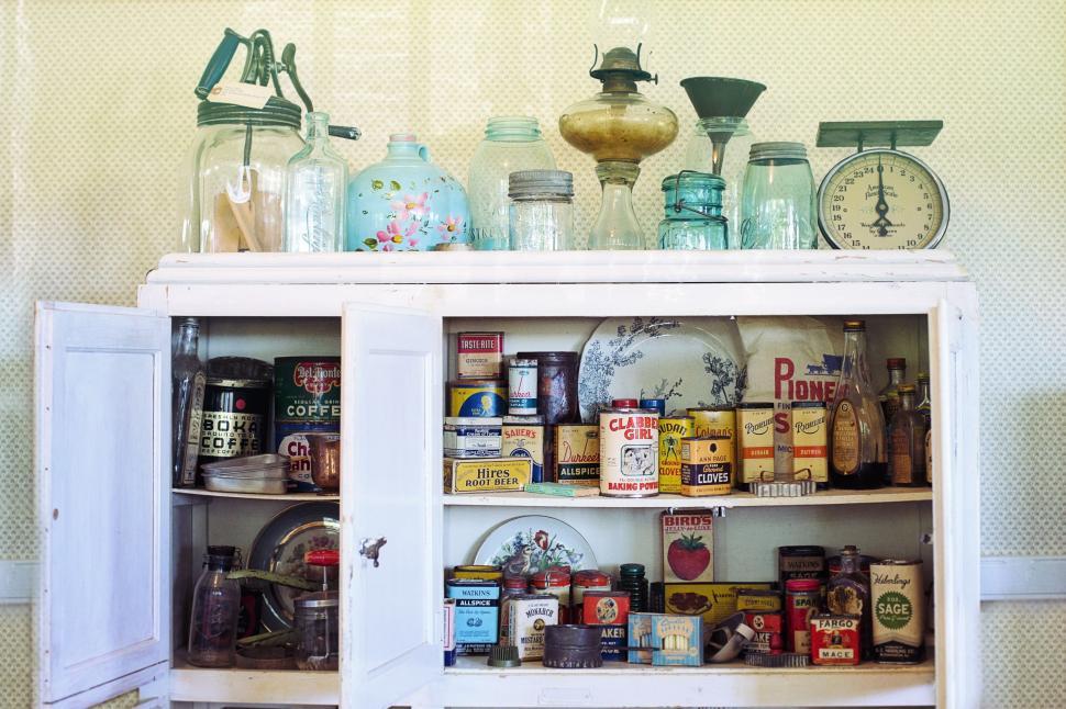 Free Image of Open kitchen cupboard with cooking ingredients  