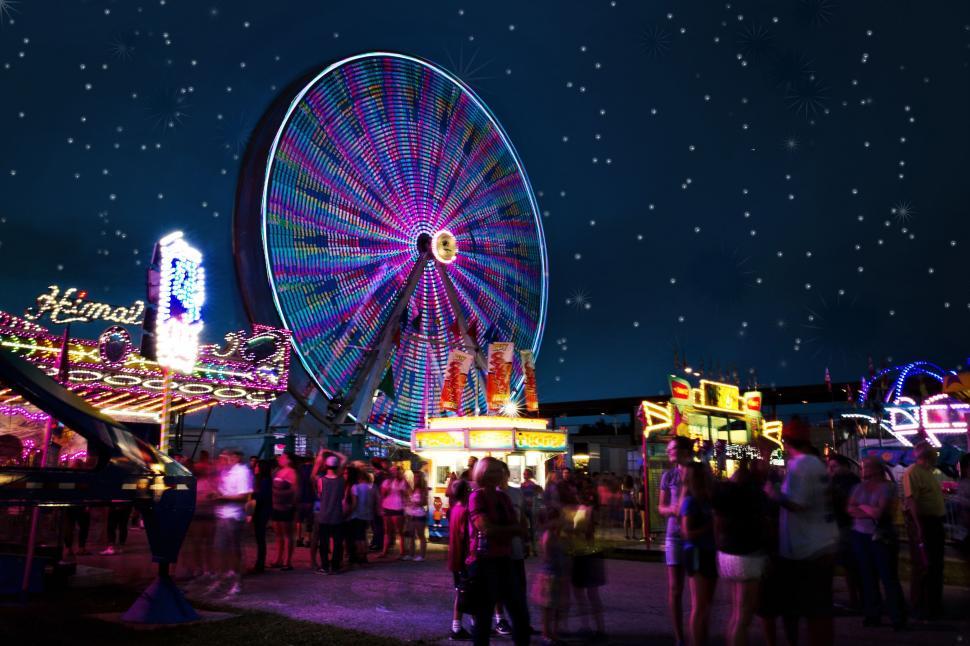 Free Image of Ferris Wheel and People With Night Sky  