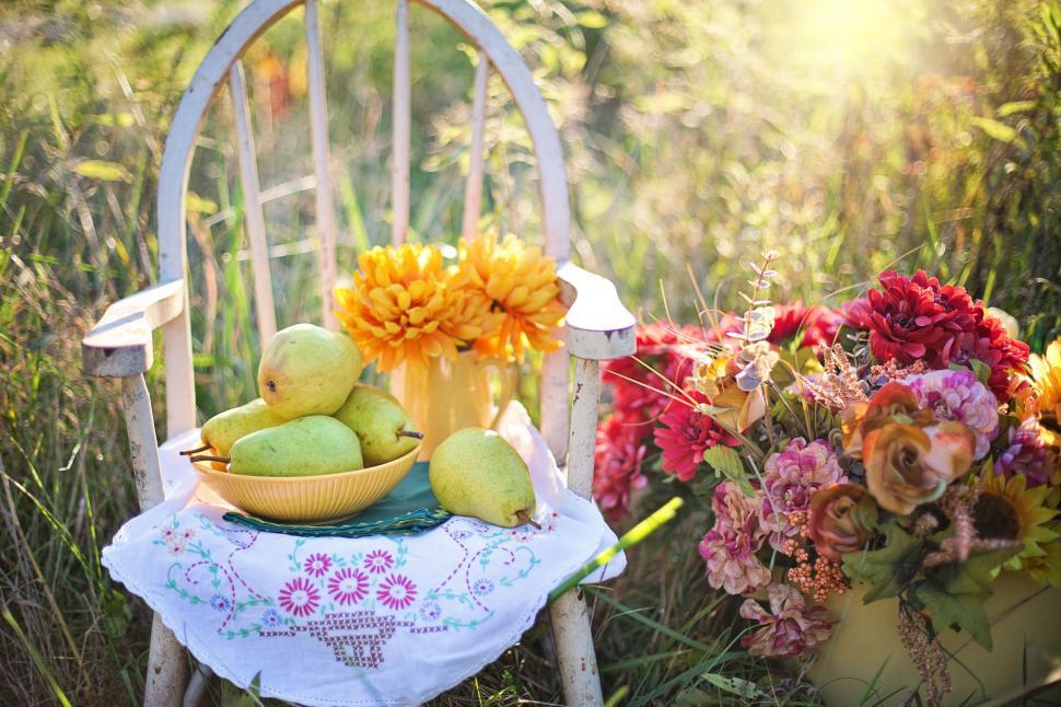 Free Image of Pears (fruit) and Chair with Colorful flowers  