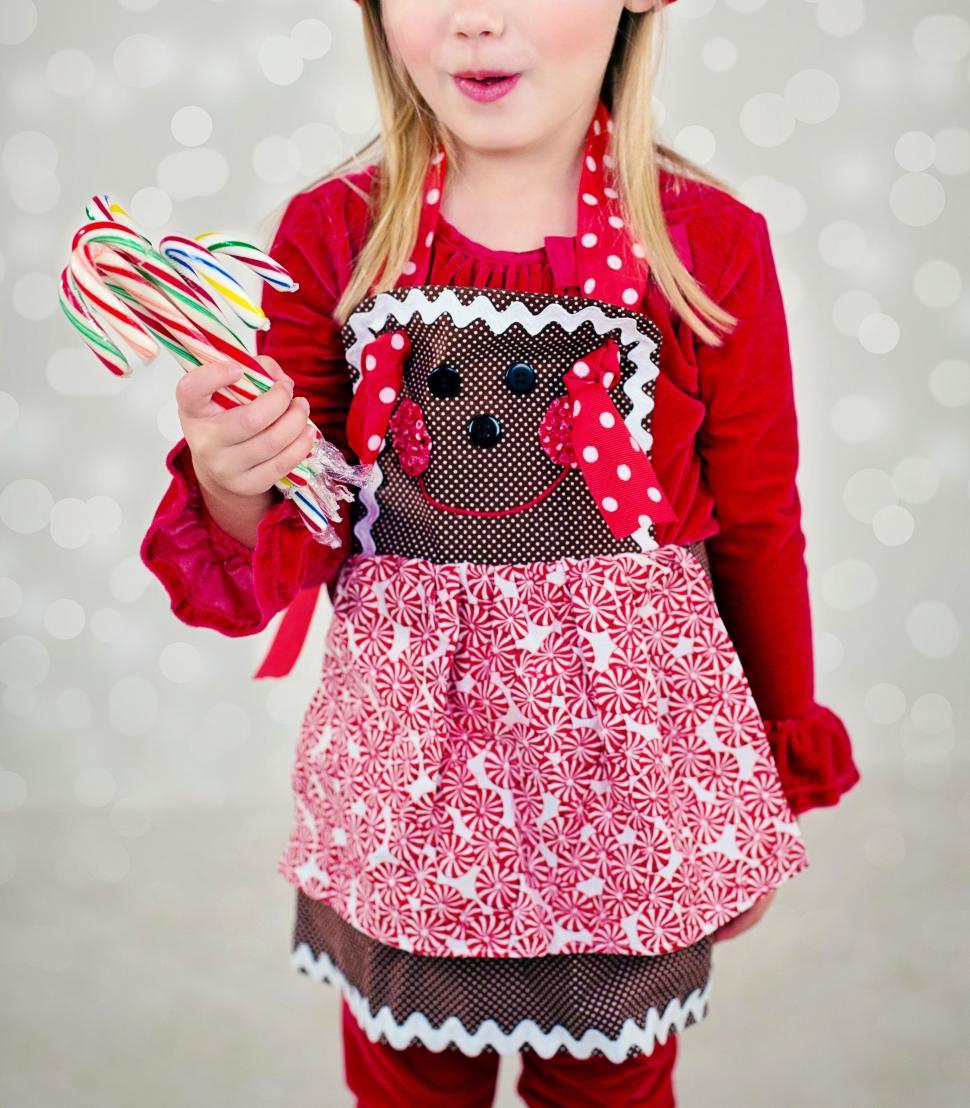 Free Image of Little Girl With Candy Canes  