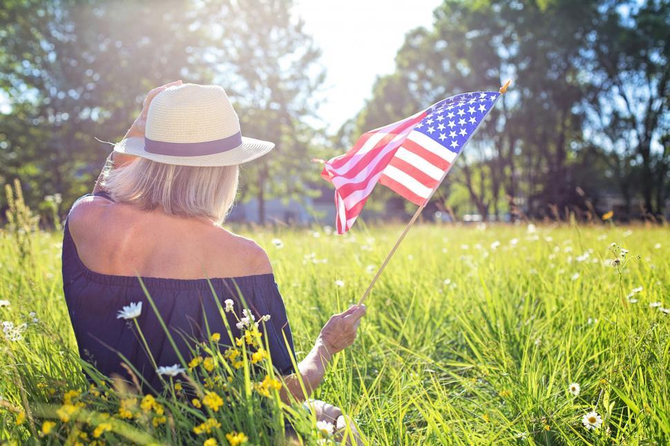 Free Image of Back View of Woman in Hat With American Flag 