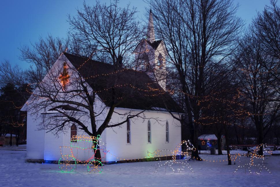 Free Image of Church With Christmas Lights In Snow  