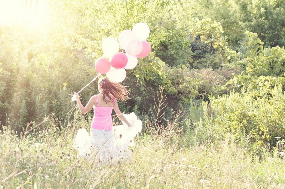Free Image of Woman With Pink and White Balloons  
