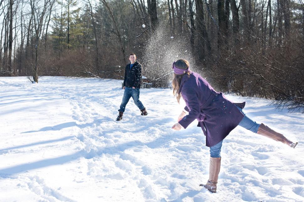 Free Image of Couple Playing With Snow  