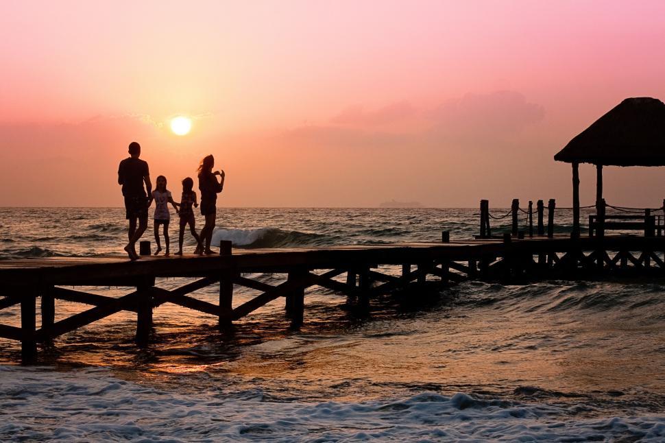 Free Image of Family on Pier at Sunset 