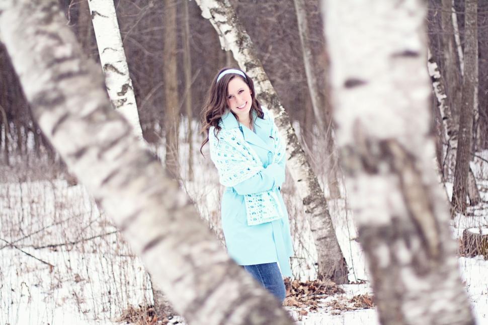 Free Image of Brunette Woman And Trees With Snow - Looking at camera  