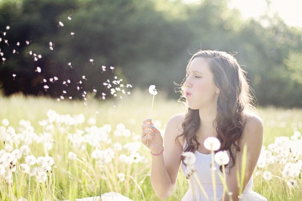 Free Image of Woman and Dandelion Flowers  