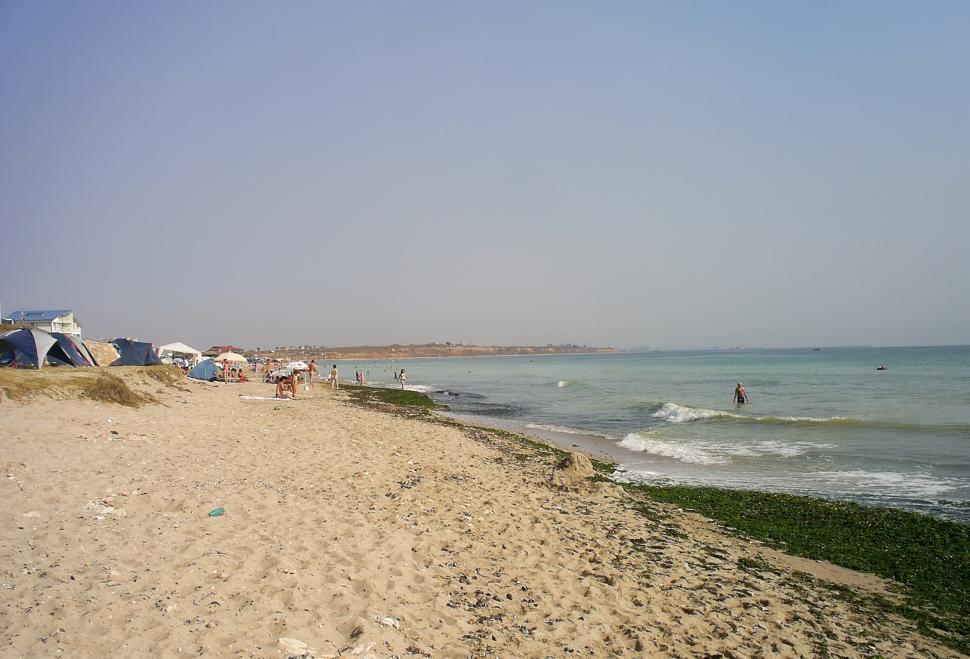 Free Image of A crowded beach filled with tourists enjoying a beautiful sunny day 