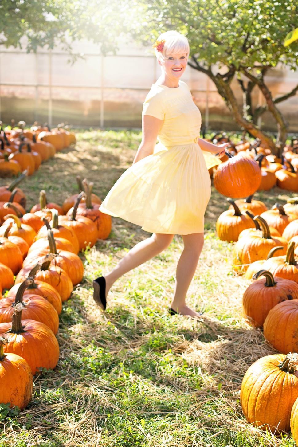 Free Image of Short Hair Woman With Pumpkins - Looking at camera  