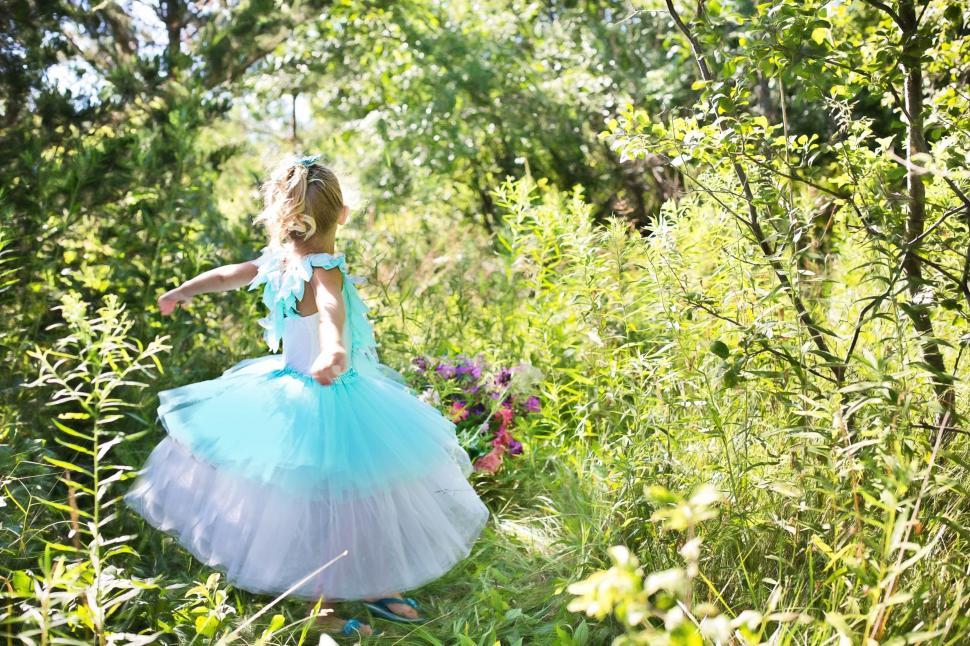 Free Image of Little girl dancing in the garden 