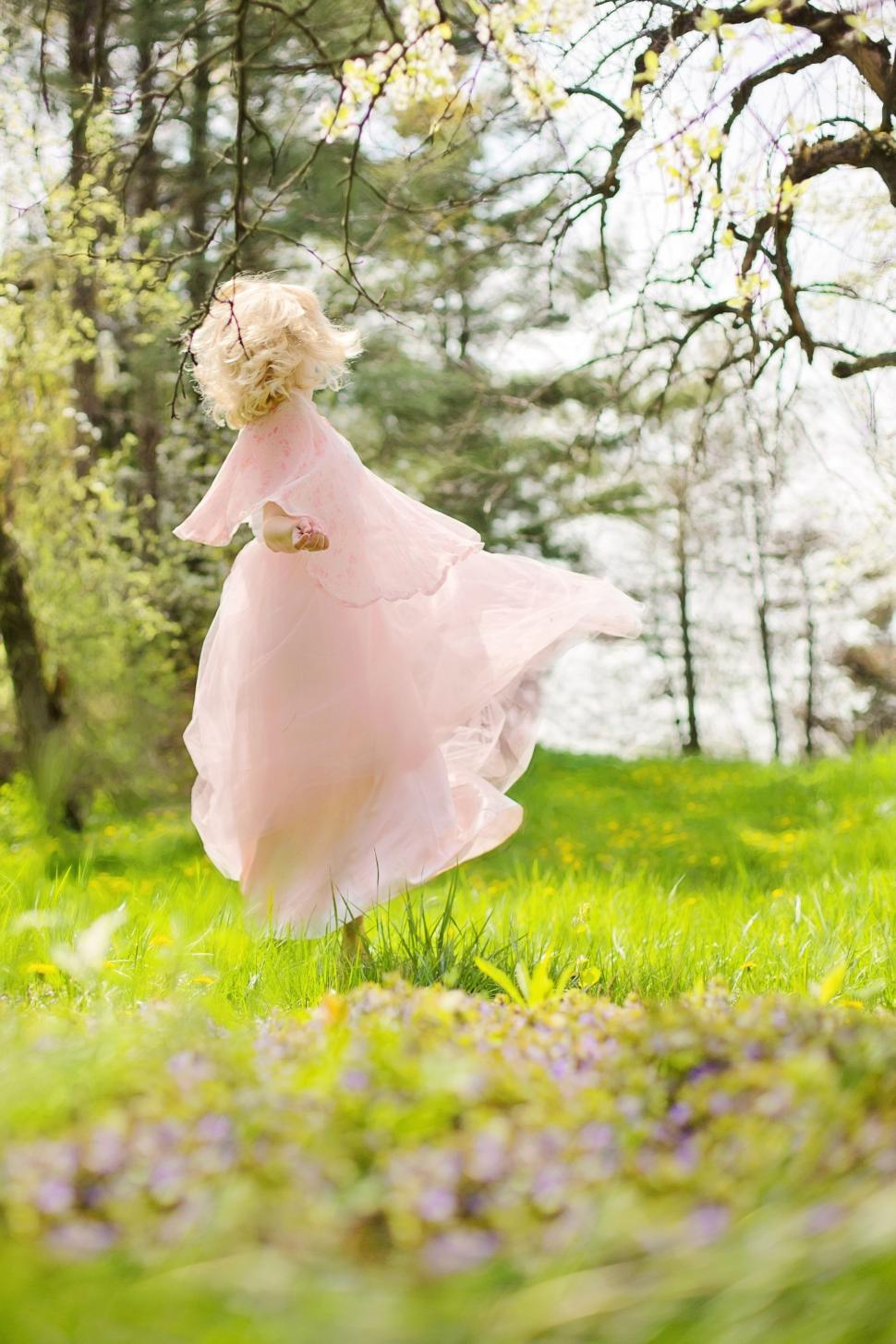 Free Image of Blonde Woman Dancing In the Meadow  