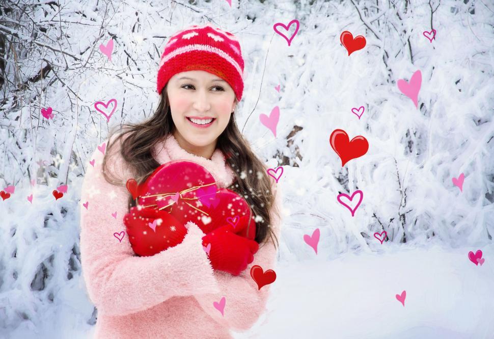Free Image of Smiling Woman With Heart in Snow - Looking away  