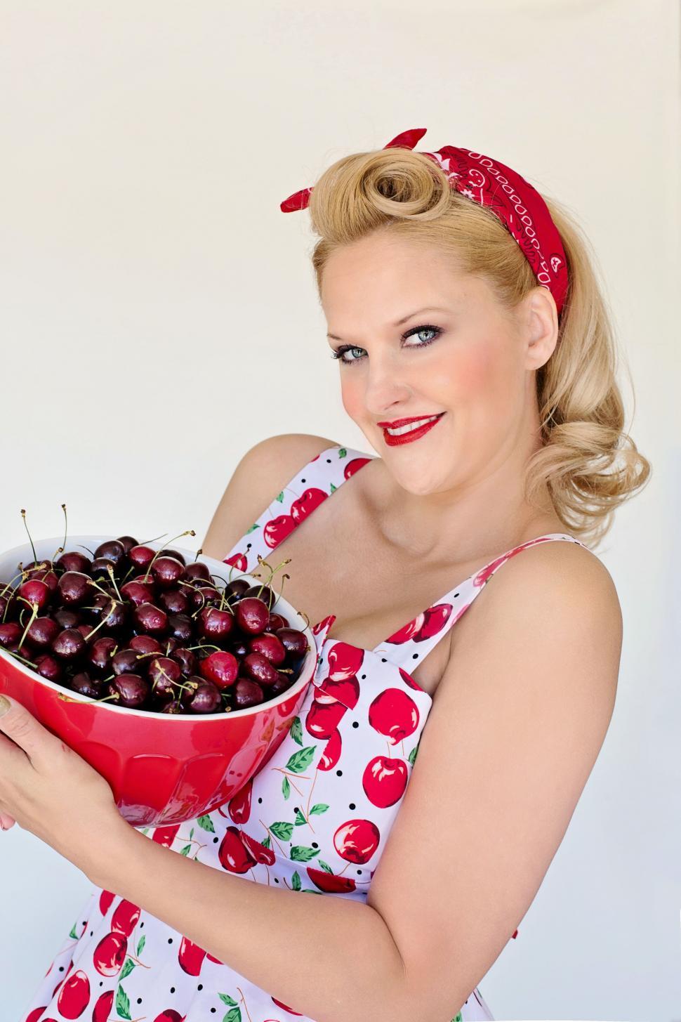 Free Image of Smiling Blonde Woman With Bowl of Cherries - Looking at camera 
