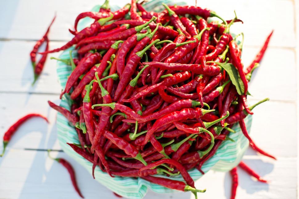 Free Image of Red Cayenne peppers on table  