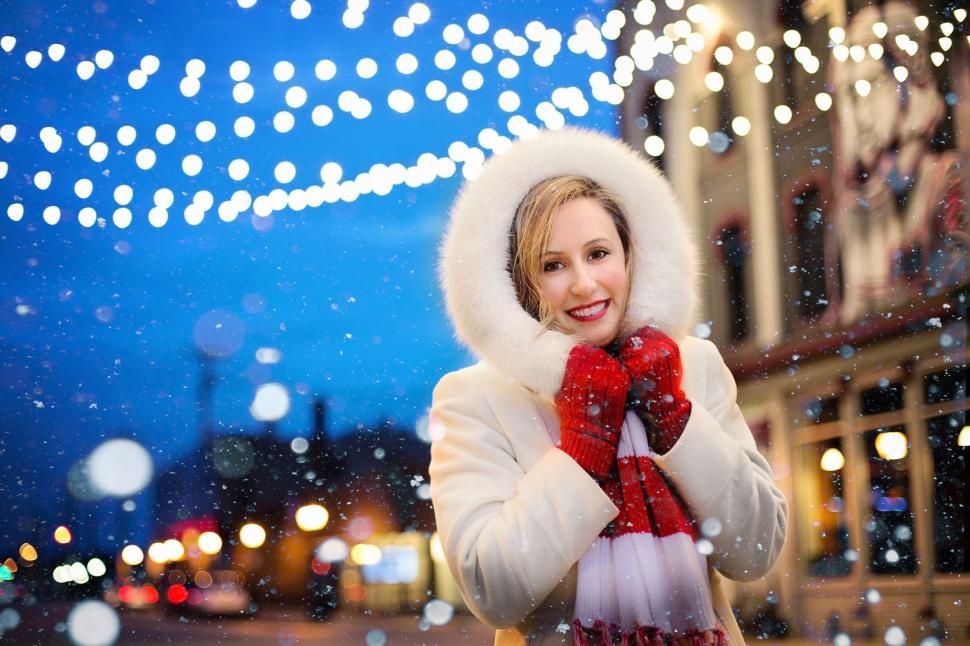 Free Image of Smiling Woman in White parka jacket - looking at camera  