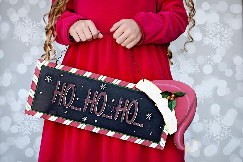 Free Image of Red Dress Girl With Christmas Placard 