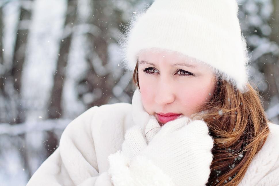 Free Image of Woman with White Hat in Snow 