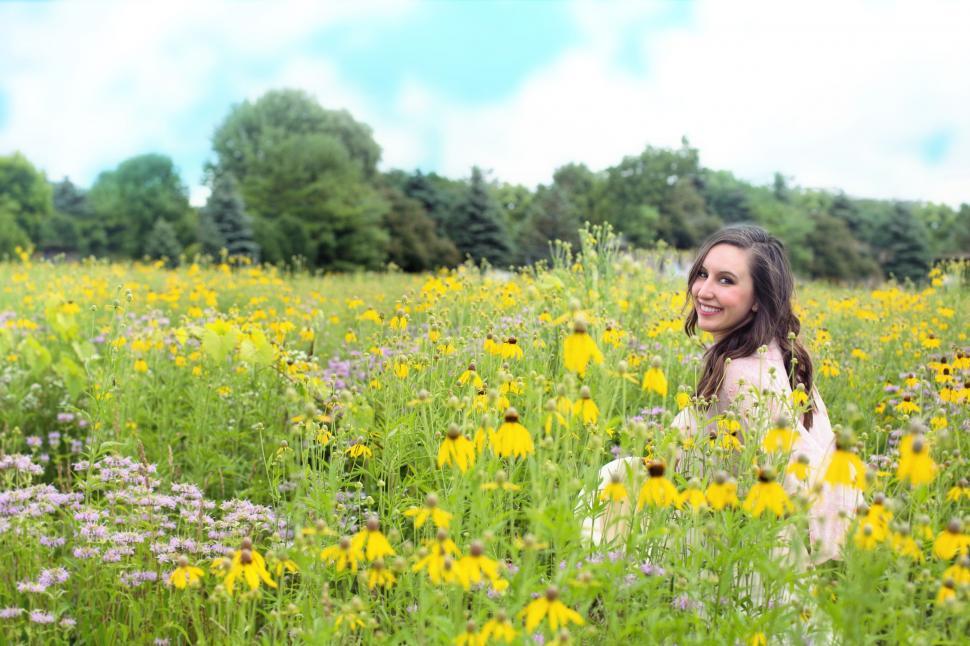 Free Image of Smiling Woman in flower field 