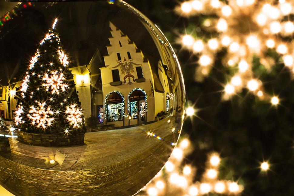 Free Image of Crystal Ball and Christmas Tree with Bokeh Lights  