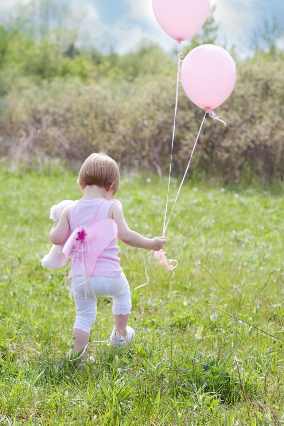 Free Image of Little Girl With Balloons  