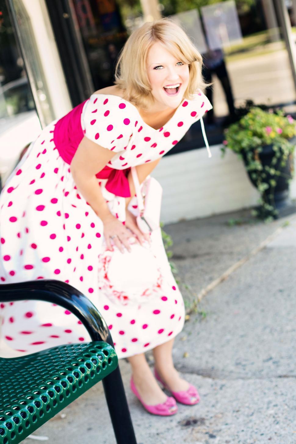 Free Image of Blonde Woman Laughing on the street - looking at camera 