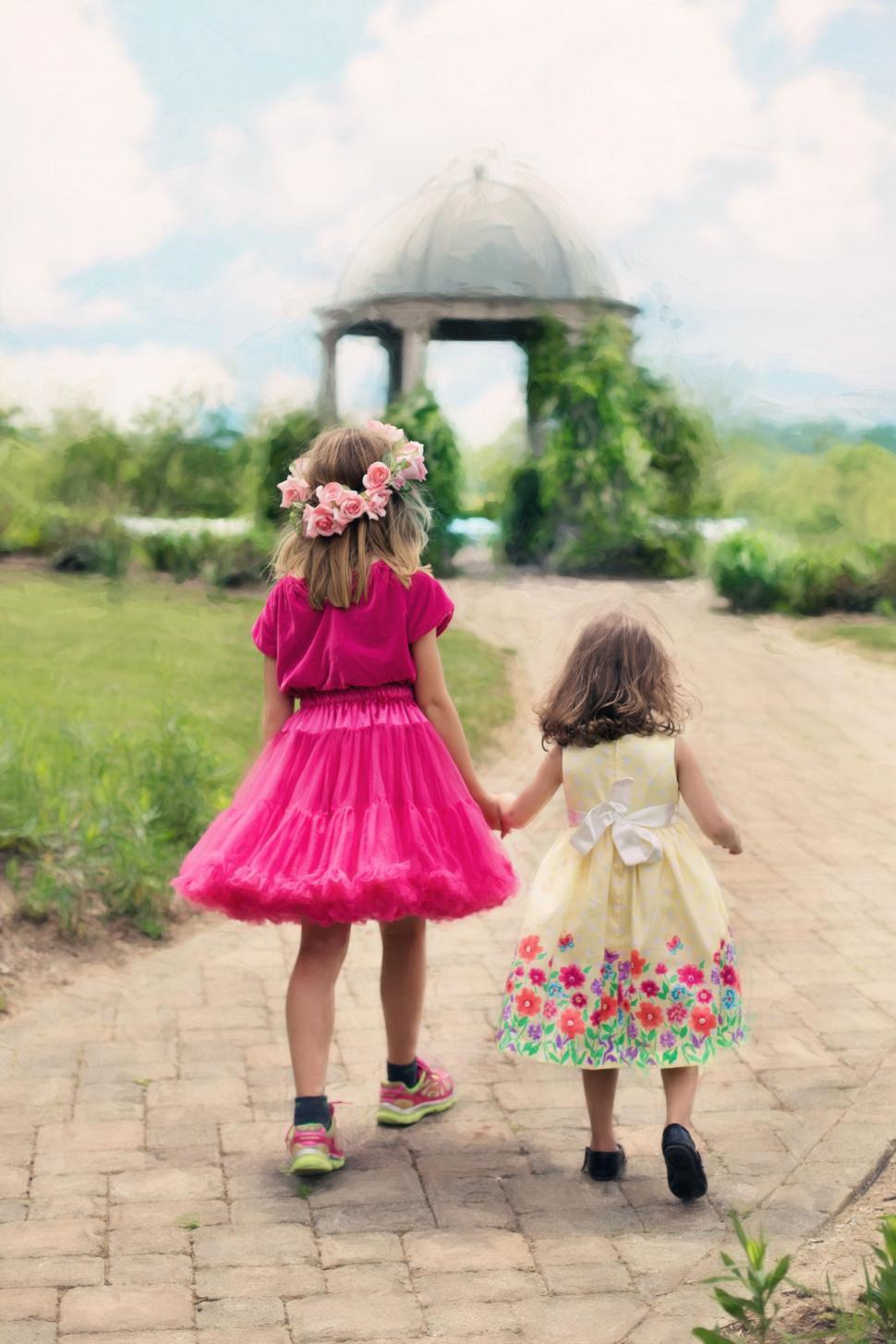 Free Image of Little Girls walking through the park  